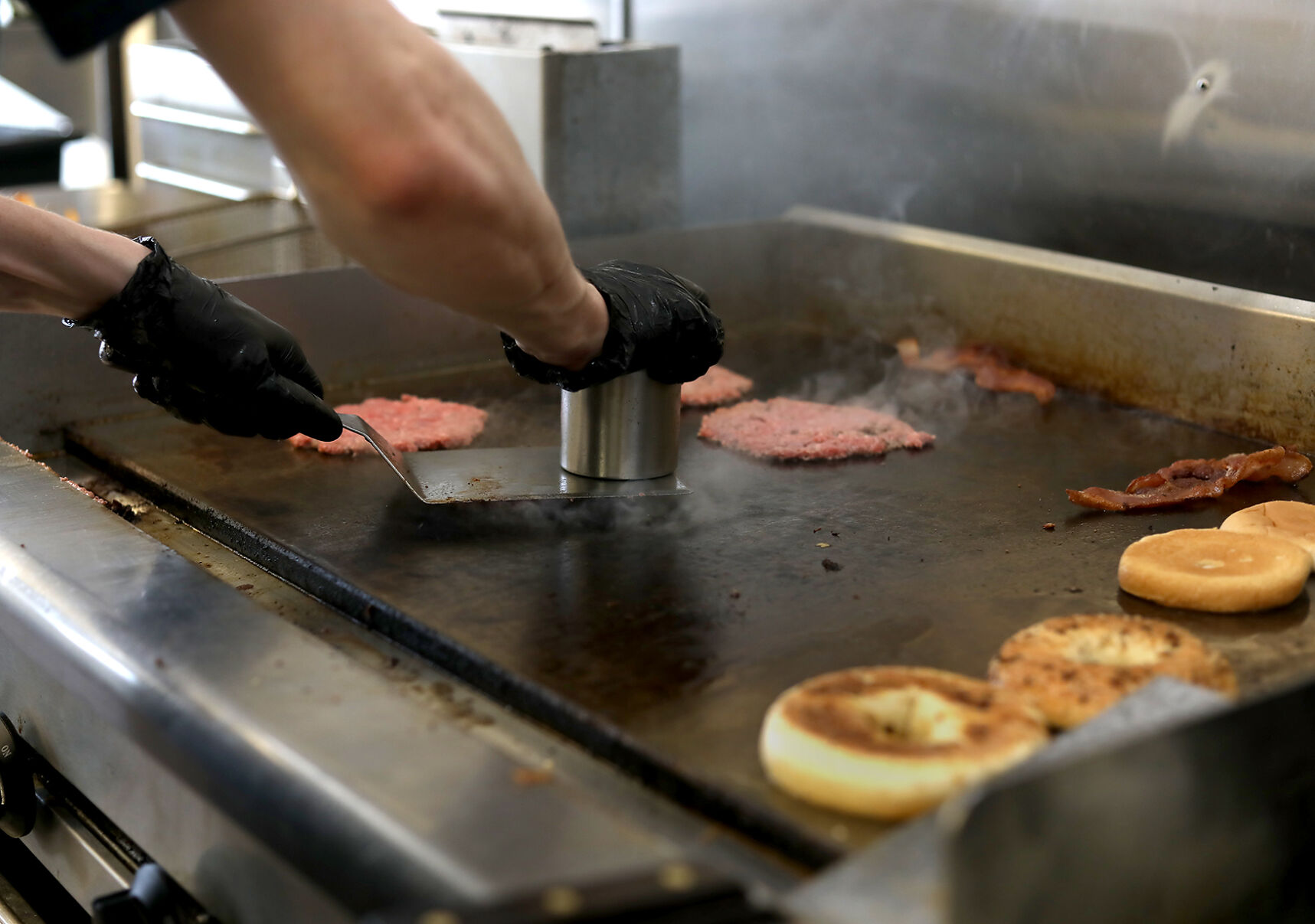 Taylor Bailey prepares burgers